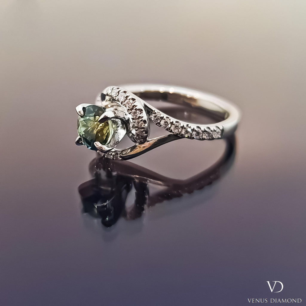 Platinum Diamond & Green Sapphire Halo Ring with a Twisted Shank
